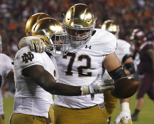 (AP Photo/Steve Helber). Notre Dame running back Dexter Williams, left, celebrates a touchdown with offensive lineman Robert Hainsey (72) during the second half of an NCAA college football game against Virginia Tech in Blacksburg, Va., Saturday, Oct. 6... (AP Photo/Steve Helber). Notre Dame running back Dexter Williams, left, celebrates a touchdown with offensive lineman Robert Hainsey (72) during the second half of an NCAA college football game against Virginia Tech in Blacksburg, Va., Saturday, Oct. 6...