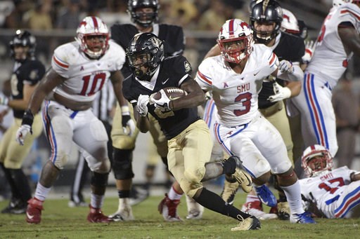 (AP Photo/Phelan M. Ebenhack). Central Florida running back Otis Anderson, center, breaks free for a 30-yard rushing touchdown past SMU defensive tackle Demerick Gary (10) and linebacker Delano Robinson (3) during the second half of an NCAA college foo... (AP Photo/Phelan M. Ebenhack). Central Florida running back Otis Anderson, center, breaks free for a 30-yard rushing touchdown past SMU defensive tackle Demerick Gary (10) and linebacker Delano Robinson (3) during the second half of an NCAA college foo...
