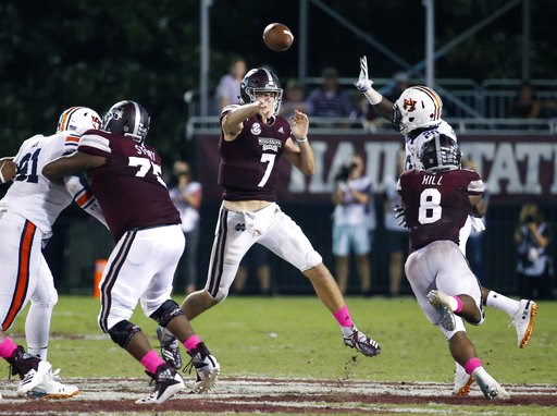 (AP Photo/Rogelio V. Solis). Mississippi State quarterback Nick Fitzgerald (7) leaps into the air as he passes under pressure by an Auburn player during the second half of their NCAA college football game in Starkville, Miss., Saturday, Oct. 6, 2018. M... (AP Photo/Rogelio V. Solis). Mississippi State quarterback Nick Fitzgerald (7) leaps into the air as he passes under pressure by an Auburn player during the second half of their NCAA college football game in Starkville, Miss., Saturday, Oct. 6, 2018. M...