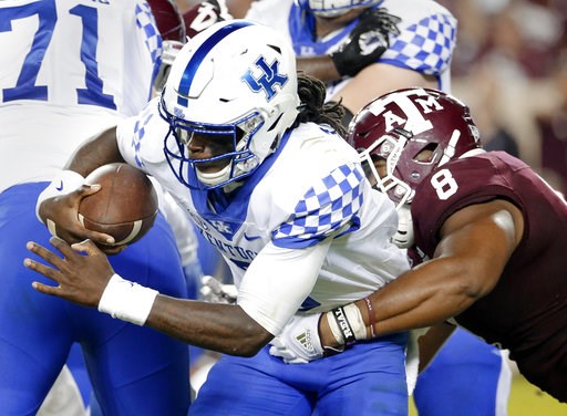 (AP Photo/Michael Wyke). Kentucky quarterback Terry Wilson (3) is sacked by Texas A&M defensive lineman Kingsley Keke (8) during the second half of an NCAA college football game Saturday, Oct. 6, 2018, in College Station, Texas. (AP Photo/Michael Wyke). Kentucky quarterback Terry Wilson (3) is sacked by Texas A&M defensive lineman Kingsley Keke (8) during the second half of an NCAA college football game Saturday, Oct. 6, 2018, in College Station, Texas.