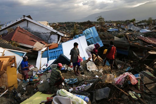 (AP Photo/Dita Alangkara). In this Friday, Oct. 5, 2018, photo, a family scavenges for salvageable items from the ruins of their house at Petobo neighborhood which was wiped out by liquefaction caused by a massive earthquake in Palu, Central Sulawesi, ... (AP Photo/Dita Alangkara). In this Friday, Oct. 5, 2018, photo, a family scavenges for salvageable items from the ruins of their house at Petobo neighborhood which was wiped out by liquefaction caused by a massive earthquake in Palu, Central Sulawesi, ...