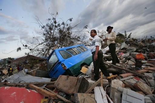 (AP Photo/Dita Alangkara). In this Friday, Oct. 5, 2018, photo, men survey the damage in the Petobo neighborhood which was wiped out by liquefaction during a massive earthquake in Palu, Central Sulawesi, Indonesia. Many in the decimated village had no ... (AP Photo/Dita Alangkara). In this Friday, Oct. 5, 2018, photo, men survey the damage in the Petobo neighborhood which was wiped out by liquefaction during a massive earthquake in Palu, Central Sulawesi, Indonesia. Many in the decimated village had no ...