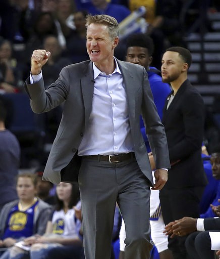(AP Photo/Ben Margot, File). FILE - In this March 14, 2018, file photo, Golden State Warriors coach Steve Kerr gestures in front of Stephen Curry during the second half of the team's NBA basketball game against the Los Angeles Lakers in Oakland, Calif.... (AP Photo/Ben Margot, File). FILE - In this March 14, 2018, file photo, Golden State Warriors coach Steve Kerr gestures in front of Stephen Curry during the second half of the team's NBA basketball game against the Los Angeles Lakers in Oakland, Calif....