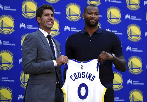 (AP Photo/Ben Margot, File). FILE - In this July 19, 2018, file photo, Golden State Warriors General Manager Bob Myers, left, holds a jersey with DeMarcus Cousins during a media conference in Oakland, Calif. Cousins can't wait to join what would be a s... (AP Photo/Ben Margot, File). FILE - In this July 19, 2018, file photo, Golden State Warriors General Manager Bob Myers, left, holds a jersey with DeMarcus Cousins during a media conference in Oakland, Calif. Cousins can't wait to join what would be a s...