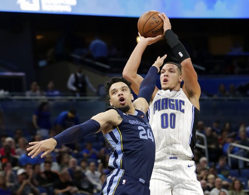 (AP Photo/John Raoux). Memphis Grizzlies' Dillon Brooks watches as Orlando Magic's Aaron Gordon (00) launches a 3-point shot during the second half of an NBA preseason basketball game Wednesday, Oct. 10, 2018, in Orlando, Fla. (AP Photo/John Raoux). Memphis Grizzlies' Dillon Brooks watches as Orlando Magic's Aaron Gordon (00) launches a 3-point shot during the second half of an NBA preseason basketball game Wednesday, Oct. 10, 2018, in Orlando, Fla.