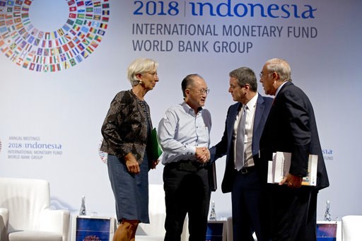 (AP Photo/Firdia Lisnawati). World Bank President Jim Yong Kim, second left, greets Director General of the World Trade Organization Roberto Azevedo, second right, Managing Director of International Monetary Fund (IMF) Christine Lagarde, left, and Secr... (AP Photo/Firdia Lisnawati). World Bank President Jim Yong Kim, second left, greets Director General of the World Trade Organization Roberto Azevedo, second right, Managing Director of International Monetary Fund (IMF) Christine Lagarde, left, and Secr...