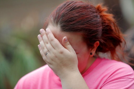 (AP Photo/Gerald Herbert). Kaylee O'Brian cries as she's unable to find her cat after several trees fell on her now-destroyed home during Hurricane Michael in Panama City, Fla., Wednesday, Oct. 10, 2018. (AP Photo/Gerald Herbert). Kaylee O'Brian cries as she's unable to find her cat after several trees fell on her now-destroyed home during Hurricane Michael in Panama City, Fla., Wednesday, Oct. 10, 2018.