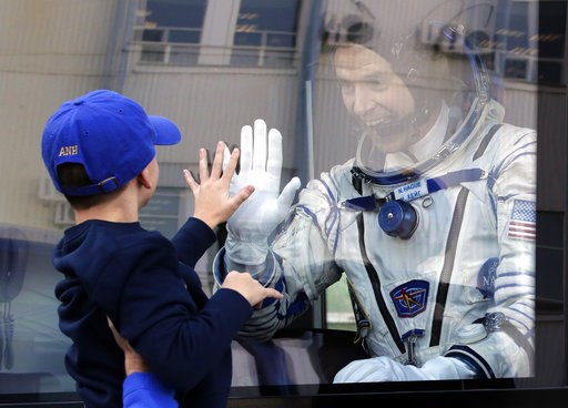 (AP Photo/Dmitri Lovetsky, Pool). U.S. astronaut Nick Hague, member of the main crew to the International Space Station (ISS), waves to his son from a bus prior to the launch of Soyuz-FG rocket at the Russian leased Baikonur cosmodrome, Kazakhstan, Thu... (AP Photo/Dmitri Lovetsky, Pool). U.S. astronaut Nick Hague, member of the main crew to the International Space Station (ISS), waves to his son from a bus prior to the launch of Soyuz-FG rocket at the Russian leased Baikonur cosmodrome, Kazakhstan, Thu...