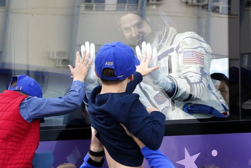 (AP Photo/Dmitri Lovetsky, Pool). U.S. astronaut Nick Hague, member of the main crew to the International Space Station (ISS), waves to his sons from a bus prior to the launch of Soyuz-FG rocket at the Russian leased Baikonur cosmodrome, Kazakhstan, Th... (AP Photo/Dmitri Lovetsky, Pool). U.S. astronaut Nick Hague, member of the main crew to the International Space Station (ISS), waves to his sons from a bus prior to the launch of Soyuz-FG rocket at the Russian leased Baikonur cosmodrome, Kazakhstan, Th...