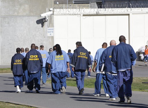 (AP Photo/Rich Pedroncelli, File). FILE - In this Feb. 26, 2013, file photo, inmates walk through the exercise yard at California State Prison Sacramento, near Folsom, Calif. The federal receiver who controls medical care in California state prisons is... (AP Photo/Rich Pedroncelli, File). FILE - In this Feb. 26, 2013, file photo, inmates walk through the exercise yard at California State Prison Sacramento, near Folsom, Calif. The federal receiver who controls medical care in California state prisons is...