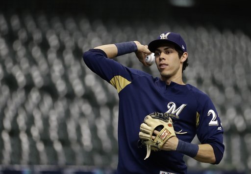 (AP Photo/Matt Slocum). Milwaukee Brewers' Christian Yelich warms up for practice for Game 1 of the National League Championship Series baseball game Los Angeles Dodgers Thursday, Oct. 11, 2018, in Milwaukee. (AP Photo/Matt Slocum). Milwaukee Brewers' Christian Yelich warms up for practice for Game 1 of the National League Championship Series baseball game Los Angeles Dodgers Thursday, Oct. 11, 2018, in Milwaukee.
