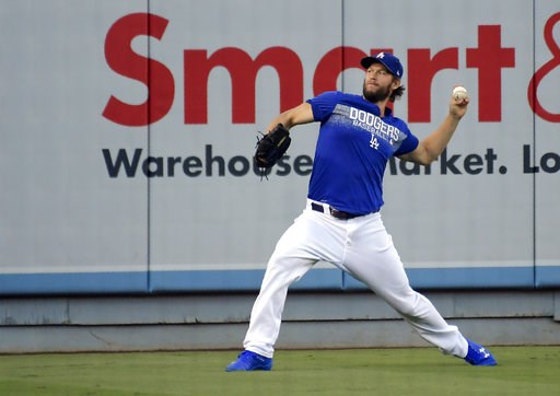 (AP Photo/Mark J. Terrill). Los Angeles Dodgers starting pitcher Clayton Kershaw warms up during practice for Game 1 of the baseball team's NLCS against the Milwaukee Brewers on Wednesday, Oct. 10, 2018, in Los Angeles. (AP Photo/Mark J. Terrill). Los Angeles Dodgers starting pitcher Clayton Kershaw warms up during practice for Game 1 of the baseball team's NLCS against the Milwaukee Brewers on Wednesday, Oct. 10, 2018, in Los Angeles.