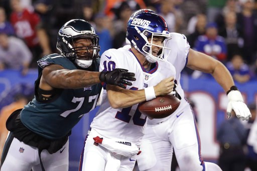 (AP Photo/Julio Cortez). Philadelphia Eagles defensive end Michael Bennett (77) strips the ball from New York Giants quarterback Eli Manning during the first half of an NFL football game Thursday, Oct. 11, 2018, in East Rutherford, N.J. (AP Photo/Julio Cortez). Philadelphia Eagles defensive end Michael Bennett (77) strips the ball from New York Giants quarterback Eli Manning during the first half of an NFL football game Thursday, Oct. 11, 2018, in East Rutherford, N.J.