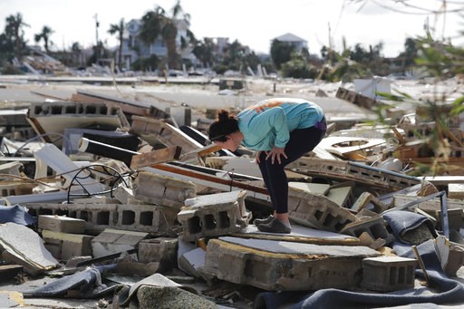 (AP Photo/Gerald Herbert). Mishelle McPherson looks for her friend in the rubble of her home, since she knows she stayed behind in the home during Hurricane Michael, in Mexico Beach, Fla., Thursday, Oct. 11, 2018. (AP Photo/Gerald Herbert). Mishelle McPherson looks for her friend in the rubble of her home, since she knows she stayed behind in the home during Hurricane Michael, in Mexico Beach, Fla., Thursday, Oct. 11, 2018.