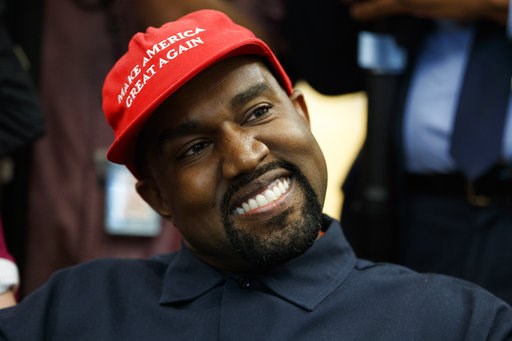 (AP Photo/Evan Vucci). Rapper Kanye West smiles as he listens to a question from a reporter during a meeting in the Oval Office of the White House with President Donald Trump, Thursday, Oct. 11, 2018, in Washington. (AP Photo/Evan Vucci). Rapper Kanye West smiles as he listens to a question from a reporter during a meeting in the Oval Office of the White House with President Donald Trump, Thursday, Oct. 11, 2018, in Washington.