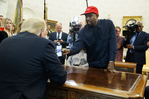 (AP Photo/Evan Vucci). Rapper Kanye West shows President Donald Trump a photograph of a hydrogen plane during a meeting in the Oval Office of the White House, Thursday, Oct. 11, 2018, in Washington. (AP Photo/Evan Vucci). Rapper Kanye West shows President Donald Trump a photograph of a hydrogen plane during a meeting in the Oval Office of the White House, Thursday, Oct. 11, 2018, in Washington.