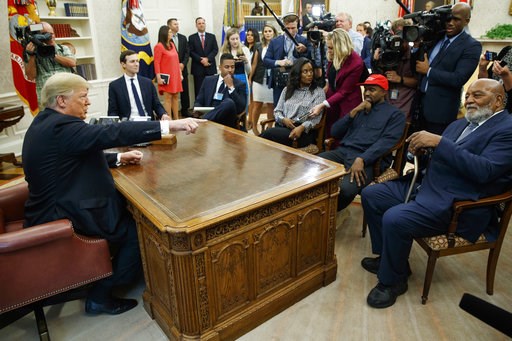 (AP Photo/Evan Vucci). President Donald Trump meets with rapper Kanye West and former football player Jim Brown in the Oval Office of the White House, Thursday, Oct. 11, 2018, in Washington. (AP Photo/Evan Vucci). President Donald Trump meets with rapper Kanye West and former football player Jim Brown in the Oval Office of the White House, Thursday, Oct. 11, 2018, in Washington.