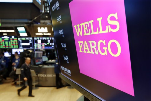 (AP Photo/Richard Drew, File). FILE- In this May 17, 2018, file photo the logo for Wells Fargo appears above a trading post on the floor of the New York Stock Exchange. Wells Fargo reports earnings Friday, Oct. 12, 2018. (AP Photo/Richard Drew, File). FILE- In this May 17, 2018, file photo the logo for Wells Fargo appears above a trading post on the floor of the New York Stock Exchange. Wells Fargo reports earnings Friday, Oct. 12, 2018.