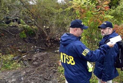(AP Photo/Hans Pennink). Members of the National Transportation Safety Board work at the scene of yesterday's fatal crash, in Schoharie, N.Y., Sunday, Oct. 7, 2018. (AP Photo/Hans Pennink). Members of the National Transportation Safety Board work at the scene of yesterday's fatal crash, in Schoharie, N.Y., Sunday, Oct. 7, 2018.