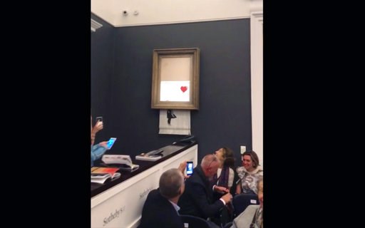 Banksy posts video saying incomplete shredding a malfunction
