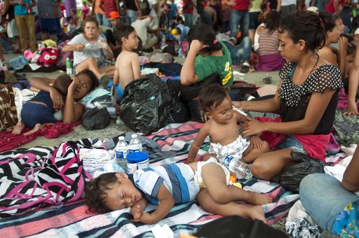 Ragged, growing caravan of migrants resumes march toward US