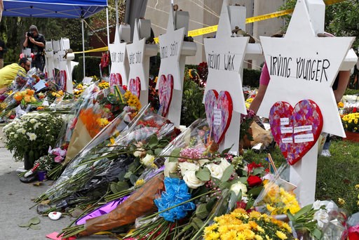 (AP Photo/Gene J. Puskar). Flowers surround Stars of David on Wednesday, Oct. 31, 2018, part of a makeshift memorial outside the Tree of Life Synagogue to the 11 people killed during worship services Saturday Oct. 27, 2018 in Pittsburgh. (AP Photo/Gene J. Puskar). Flowers surround Stars of David on Wednesday, Oct. 31, 2018, part of a makeshift memorial outside the Tree of Life Synagogue to the 11 people killed during worship services Saturday Oct. 27, 2018 in Pittsburgh.