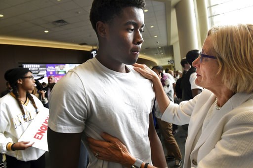 (Jean Pieri/Pioneer Press via AP). In this Oct. 25, 2018, photo University of St. Thomas president Dr. Julie Sullivan, right, talks to Kevyn Perkins at a protest in Anderson Student Center at the University of St. Thomas in St. Paul, Minn. The protest ... (Jean Pieri/Pioneer Press via AP). In this Oct. 25, 2018, photo University of St. Thomas president Dr. Julie Sullivan, right, talks to Kevyn Perkins at a protest in Anderson Student Center at the University of St. Thomas in St. Paul, Minn. The protest ...