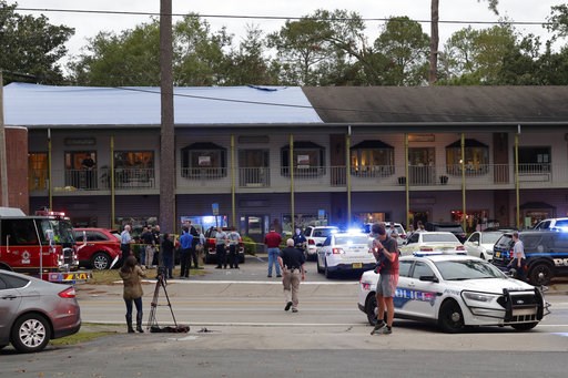 (Tori Schneider/Tallahassee Democrat via AP). Police investigators work the scene of a shooting, Friday, Nov. 2, 2018, in Tallahassee, Fla. A shooter killed one person and critically wounded four others at a yoga studio in Florida's capital before kill... (Tori Schneider/Tallahassee Democrat via AP). Police investigators work the scene of a shooting, Friday, Nov. 2, 2018, in Tallahassee, Fla. A shooter killed one person and critically wounded four others at a yoga studio in Florida's capital before kill...