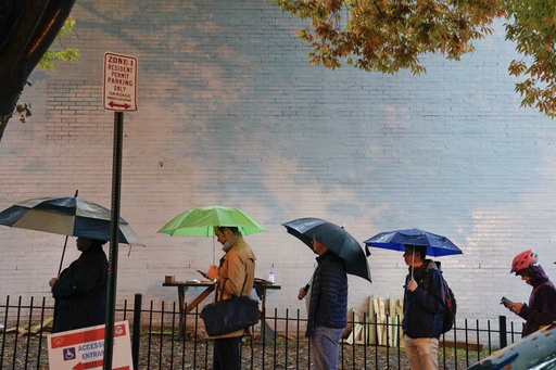 (AP Photo/Pablo Martinez Monsivais). Voters line up in the rain outside Bright Family and Youth Center in the Columbia Heights neighborhood in Washington, Tuesday, Nov. 6, 2018. Across the country, voters headed to the polls Tuesday in one of the most ... (AP Photo/Pablo Martinez Monsivais). Voters line up in the rain outside Bright Family and Youth Center in the Columbia Heights neighborhood in Washington, Tuesday, Nov. 6, 2018. Across the country, voters headed to the polls Tuesday in one of the most ...