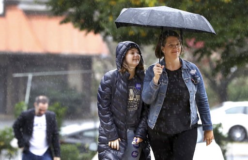 (AP Photo/Chris Knight). Jess King, right, Democratic nominee for Pennsylvania's 10th congressional district, and her daughter Esme King-Martin, 13, arrive to cast her vote at Martin Luther King Elementary School in Lancaster, Pa., Tuesday, Nov. 6, 2018. (AP Photo/Chris Knight). Jess King, right, Democratic nominee for Pennsylvania's 10th congressional district, and her daughter Esme King-Martin, 13, arrive to cast her vote at Martin Luther King Elementary School in Lancaster, Pa., Tuesday, Nov. 6, 2018.