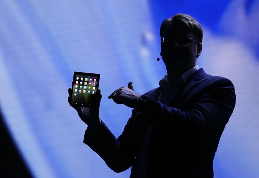 (AP Photo/Eric Risberg). Justin Denison, SVP of Mobile Product Development, shows off the Infinity Flex Display of a folding smartphone during the keynote address of the Samsung Developer Conference Wednesday, Nov. 7, 2018, in San Francisco. (AP Photo/Eric Risberg). Justin Denison, SVP of Mobile Product Development, shows off the Infinity Flex Display of a folding smartphone during the keynote address of the Samsung Developer Conference Wednesday, Nov. 7, 2018, in San Francisco.