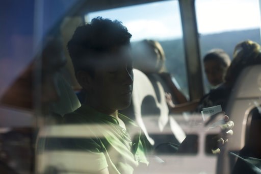 (AP Photo/Moises Castillo). In this Nov. 1, 2018 photo, 16-year-old Reny Maudiel, who was deported from Mexico, sits on a bus that will return him home, at the Metropolitan Grand Central bus terminal in San Pedro Sula, Honduras. Maudiel, who was travel... (AP Photo/Moises Castillo). In this Nov. 1, 2018 photo, 16-year-old Reny Maudiel, who was deported from Mexico, sits on a bus that will return him home, at the Metropolitan Grand Central bus terminal in San Pedro Sula, Honduras. Maudiel, who was travel...