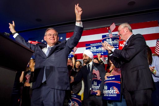 (Tom Gralish/The Philadelphia Inquirer via AP). U.S. Sen. Bob Menendez celebrates his re-election in Hoboken, N.J., Tuesday, Nov. 6, 2018, while Gov. Phil Murphy stands at right. (Tom Gralish/The Philadelphia Inquirer via AP). U.S. Sen. Bob Menendez celebrates his re-election in Hoboken, N.J., Tuesday, Nov. 6, 2018, while Gov. Phil Murphy stands at right.