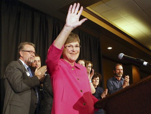 (Thad Allton /The Topeka Capital-Journal via AP). Democrat Laura Kelly waved to the crowd at the Ramada Hotel and Convention Center in Topeka after she won election Tuesday, Nov. 6, 2018, to become the next Kansas governor. On the left is her running m... (Thad Allton /The Topeka Capital-Journal via AP). Democrat Laura Kelly waved to the crowd at the Ramada Hotel and Convention Center in Topeka after she won election Tuesday, Nov. 6, 2018, to become the next Kansas governor. On the left is her running m...