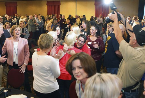 (Thad Allton/The Topeka Capital-Journal via AP). Supporters Governor-elect Laura Kelly celebrate her win over Republican Kris Kobach in Topeka, Kansas, Tuesday night, Nov. 6, 2018. (Thad Allton/The Topeka Capital-Journal via AP). Supporters Governor-elect Laura Kelly celebrate her win over Republican Kris Kobach in Topeka, Kansas, Tuesday night, Nov. 6, 2018.
