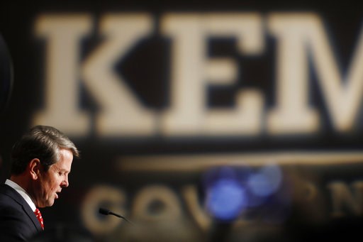 Georgia's Kemp says he's governor-elect, Abrams fights on