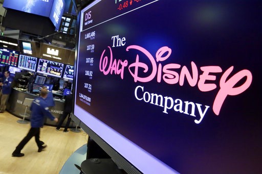 (AP Photo/Richard Drew, File). FILE - In this Aug. 8, 2017, file photo, the Walt Disney Co. logo appears on a screen above the floor of the New York Stock Exchange. The Walt Disney Co. reports earnings Thursday, Nov. 8. (AP Photo/Richard Drew, File). FILE - In this Aug. 8, 2017, file photo, the Walt Disney Co. logo appears on a screen above the floor of the New York Stock Exchange. The Walt Disney Co. reports earnings Thursday, Nov. 8.
