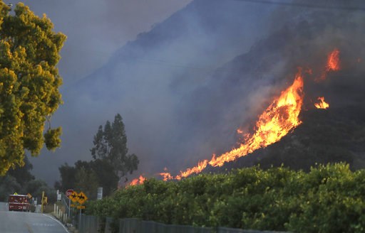 Fires besiege California city reeling from mass shooting