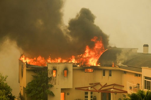 (AP Photo/Ringo H.W. Chiu). A wildire burns a home near Malibu Lake in Malibu, Calif., Friday, Nov. 9, 2018. About two-thirds of the city of Malibu was ordered evacuated early Friday as a ferocious wildfire roared toward the beachside community that ... (AP Photo/Ringo H.W. Chiu). A wildire burns a home near Malibu Lake in Malibu, Calif., Friday, Nov. 9, 2018. About two-thirds of the city of Malibu was ordered evacuated early Friday as a ferocious wildfire roared toward the beachside community that ...