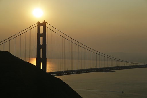 (AP Photo/Eric Risberg). Smoke from wildfires obscures the San Francisco skyline behind the Golden Gate Bridge Friday, Nov. 9, 2018, near Sausalito, Calif. A California fire official says a blaze in Northern California nearly quadrupled in size overnig... (AP Photo/Eric Risberg). Smoke from wildfires obscures the San Francisco skyline behind the Golden Gate Bridge Friday, Nov. 9, 2018, near Sausalito, Calif. A California fire official says a blaze in Northern California nearly quadrupled in size overnig...