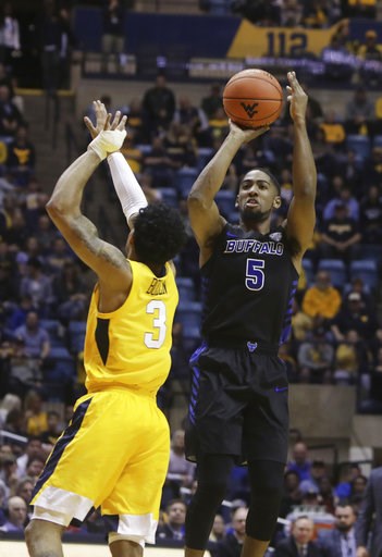 Massinburg scores 43, Buffalo stuns No. 13 WVU 99-94 in OT