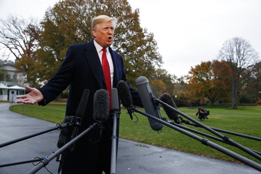 (AP Photo/Evan Vucci). President Donald Trump talks with reporters before departing for France on the South Lawn of the White House, Friday, Nov. 9, 2018, in Washington. (AP Photo/Evan Vucci). President Donald Trump talks with reporters before departing for France on the South Lawn of the White House, Friday, Nov. 9, 2018, in Washington.