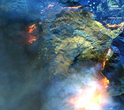 (DigitalGlobe, a Maxar company via AP). This shortwave infrared (SWIR) satellite image provided by DigitalGlobe shows an area around Concow Reservoir, center, surrounded by active fires including in and around Magalia community, left, in northern Calif... (DigitalGlobe, a Maxar company via AP). This shortwave infrared (SWIR) satellite image provided by DigitalGlobe shows an area around Concow Reservoir, center, surrounded by active fires including in and around Magalia community, left, in northern Calif...
