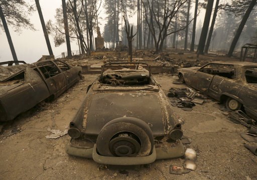 (AP Photo/Rich Pedroncelli). Three cars destroyed by a wildfire sit at a burned out home Friday, Nov. 9, 2018, in Paradise, Calif. Authorities have confirmed that at least six people have died in the fire that has consumed more than 70,000 acres and de... (AP Photo/Rich Pedroncelli). Three cars destroyed by a wildfire sit at a burned out home Friday, Nov. 9, 2018, in Paradise, Calif. Authorities have confirmed that at least six people have died in the fire that has consumed more than 70,000 acres and de...