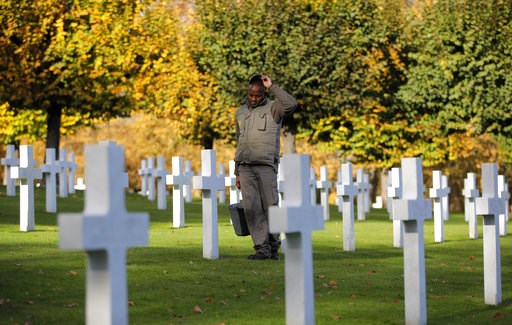 (AP Photo/Vadim Ghirda). A cemetery employee walks between graves of American serviceman killed during WWI ahead of celebrations of the WWI centenary at the American Cemetery in Suresnes, on the outskirts of Paris, France, Friday, Nov. 9, 2018. World W... (AP Photo/Vadim Ghirda). A cemetery employee walks between graves of American serviceman killed during WWI ahead of celebrations of the WWI centenary at the American Cemetery in Suresnes, on the outskirts of Paris, France, Friday, Nov. 9, 2018. World W...