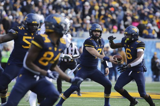 Grier throws for 3 TDs, No. 7 West Virginia beats TCU 47-10