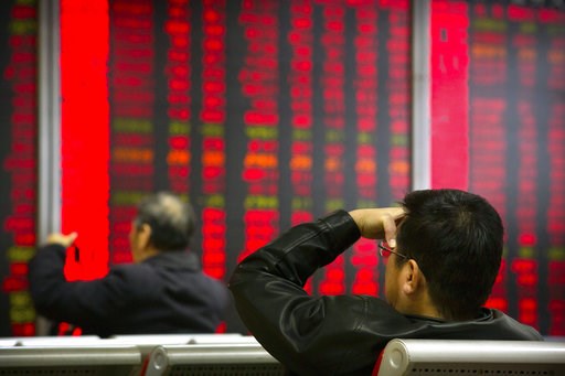 (AP Photo/Mark Schiefelbein). In this Oct. 31, 2018, photo, Chinese investors monitor stock prices at a brokerage house in Beijing. China's government is trying to dispel stock market gloom and talk prices back up with promises of tax cuts and a media ... (AP Photo/Mark Schiefelbein). In this Oct. 31, 2018, photo, Chinese investors monitor stock prices at a brokerage house in Beijing. China's government is trying to dispel stock market gloom and talk prices back up with promises of tax cuts and a media ...
