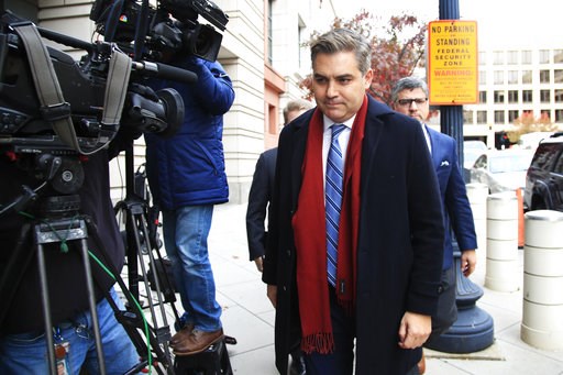 The Latest: Judge delays ruling over White House press pass