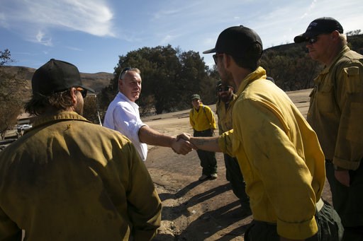 Winds that fanned Southern California wildfire diminish