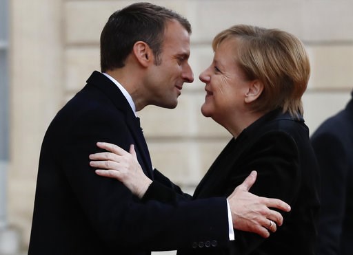 Macron, Merkel seek common approaches to Trump, euro